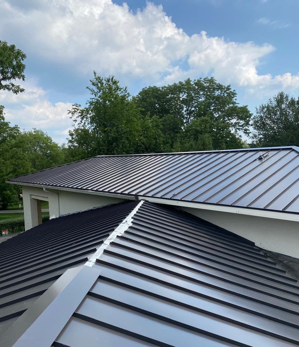 Black standing seam metal hip roof, private residence, Middle Tennessee
