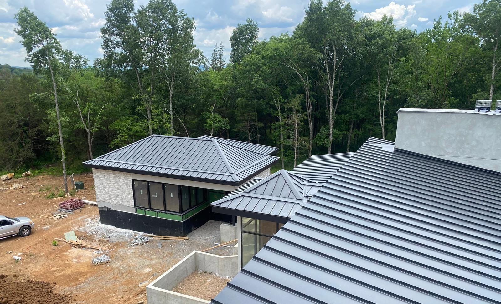Grey standing seam metal roof on a new home, private residence, Middle Tennessee
