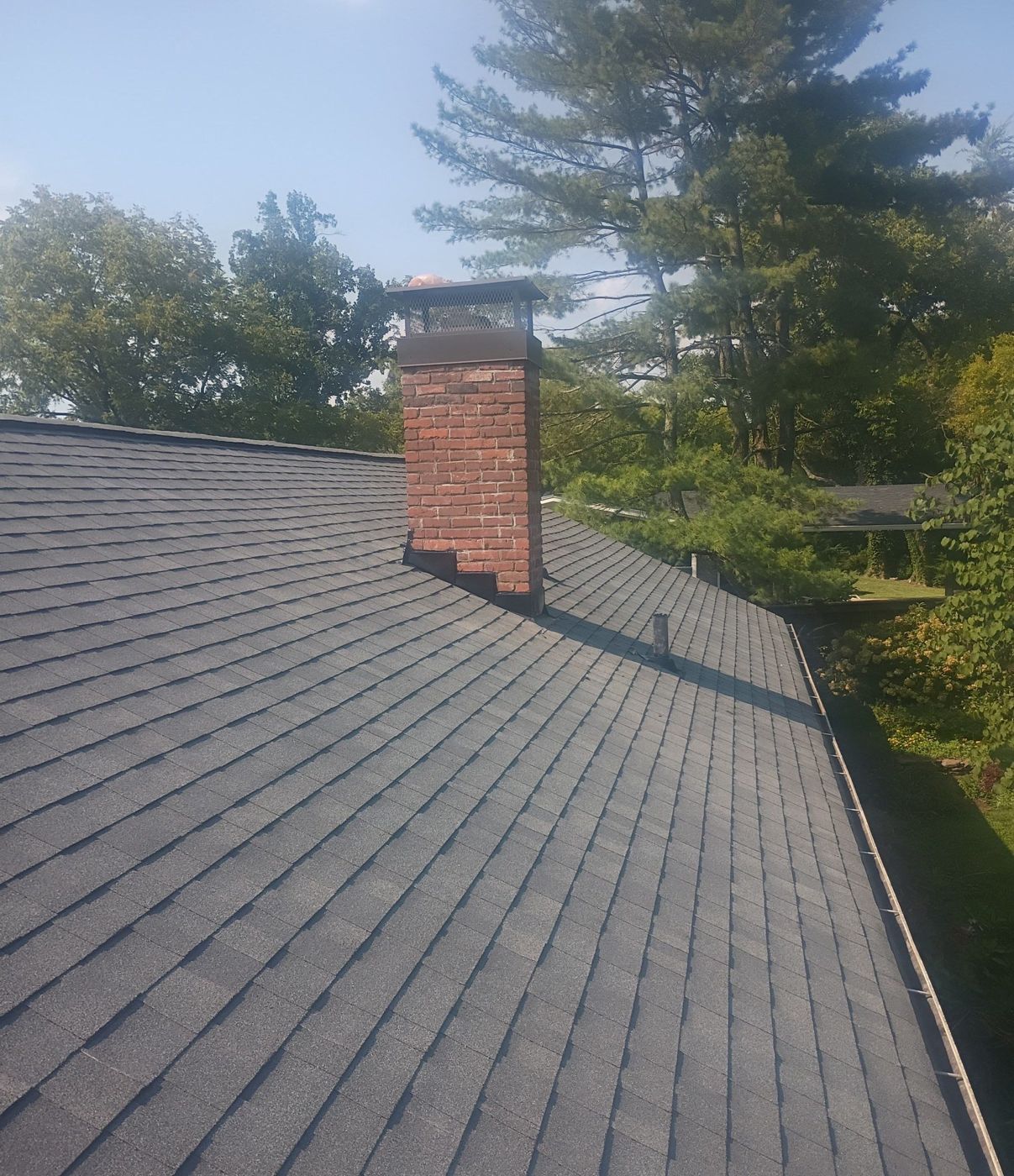 Finished architectural shingle roof with new chimney flashing, private residence, Middle Tennessee