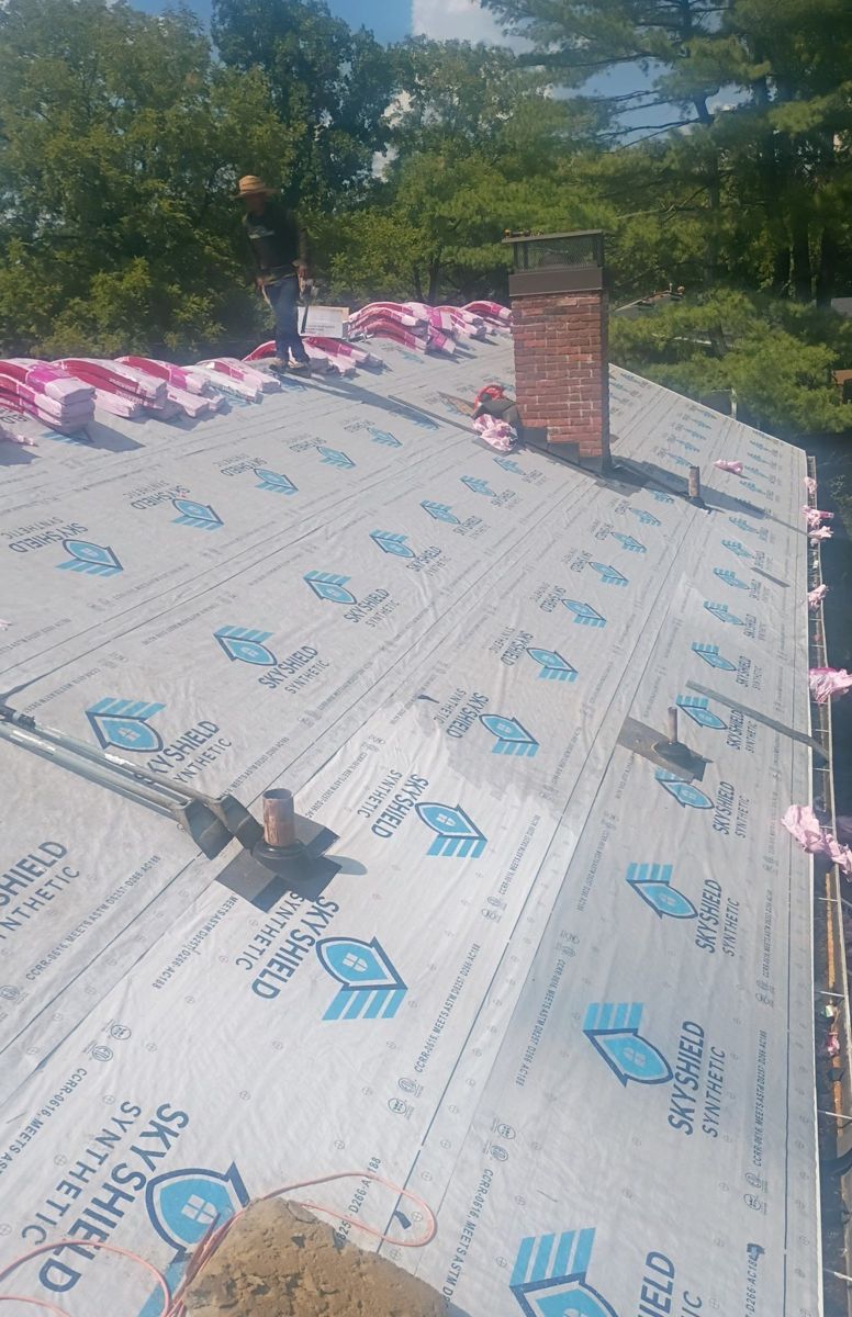 Synthetic underlayment and ice and water shield being installed, private residence, Middle Tennessee